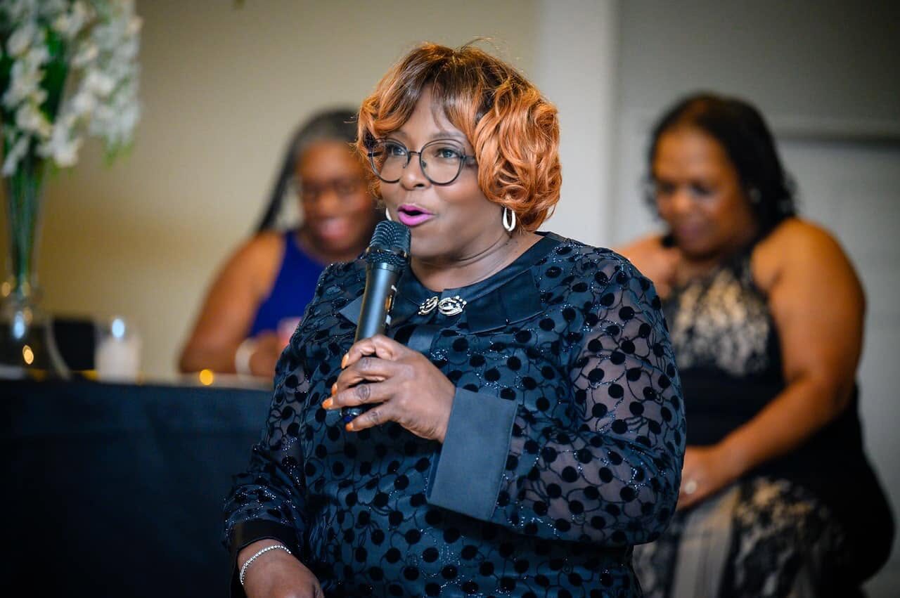 Overseer Mamie V. Gamble preaching and sharing her testimony